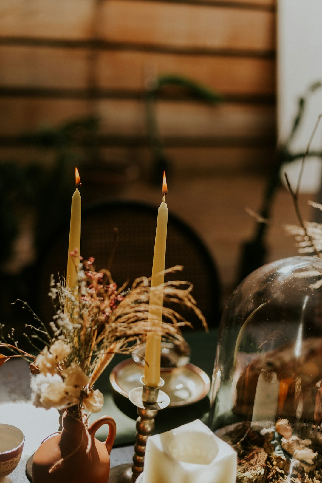 lighted candles on clear glass candle holder