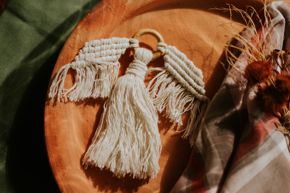 white and black rope on brown wooden table