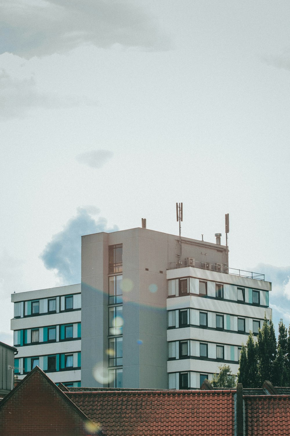 brown and white concrete building under white sky during daytime