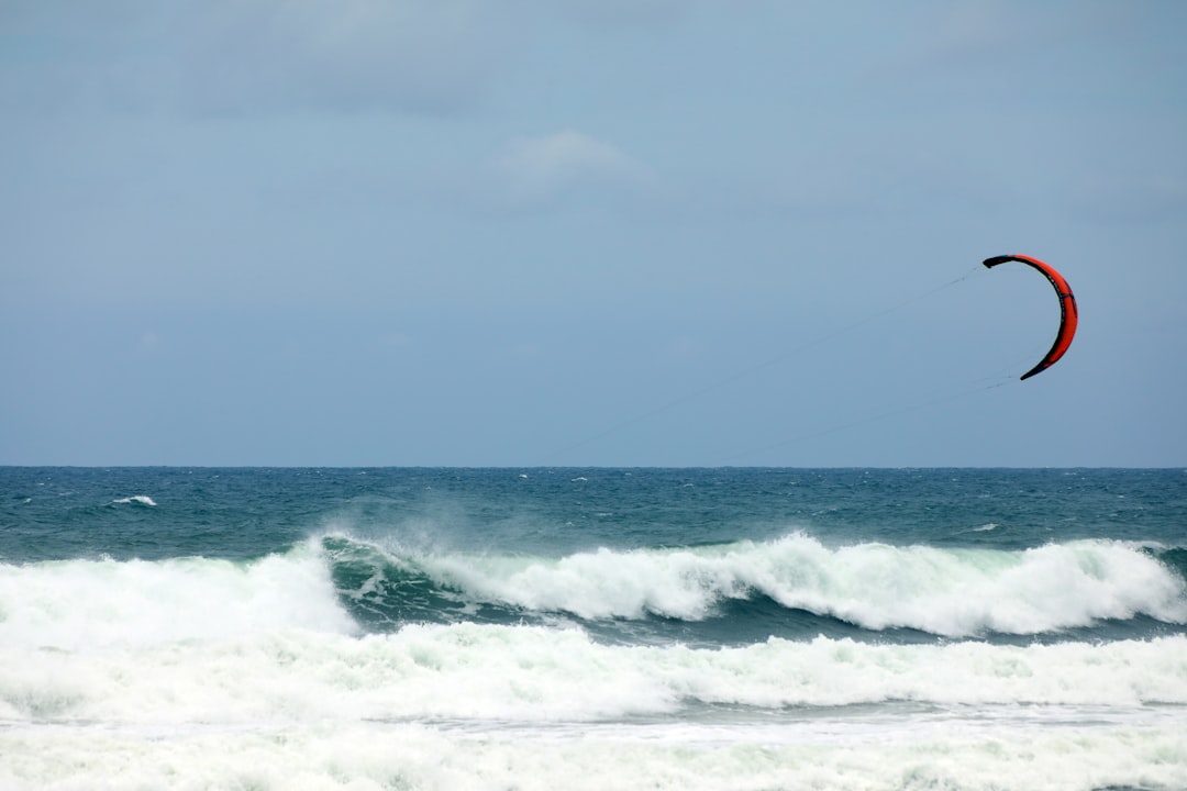 ocean waves under cloudy sky during daytime