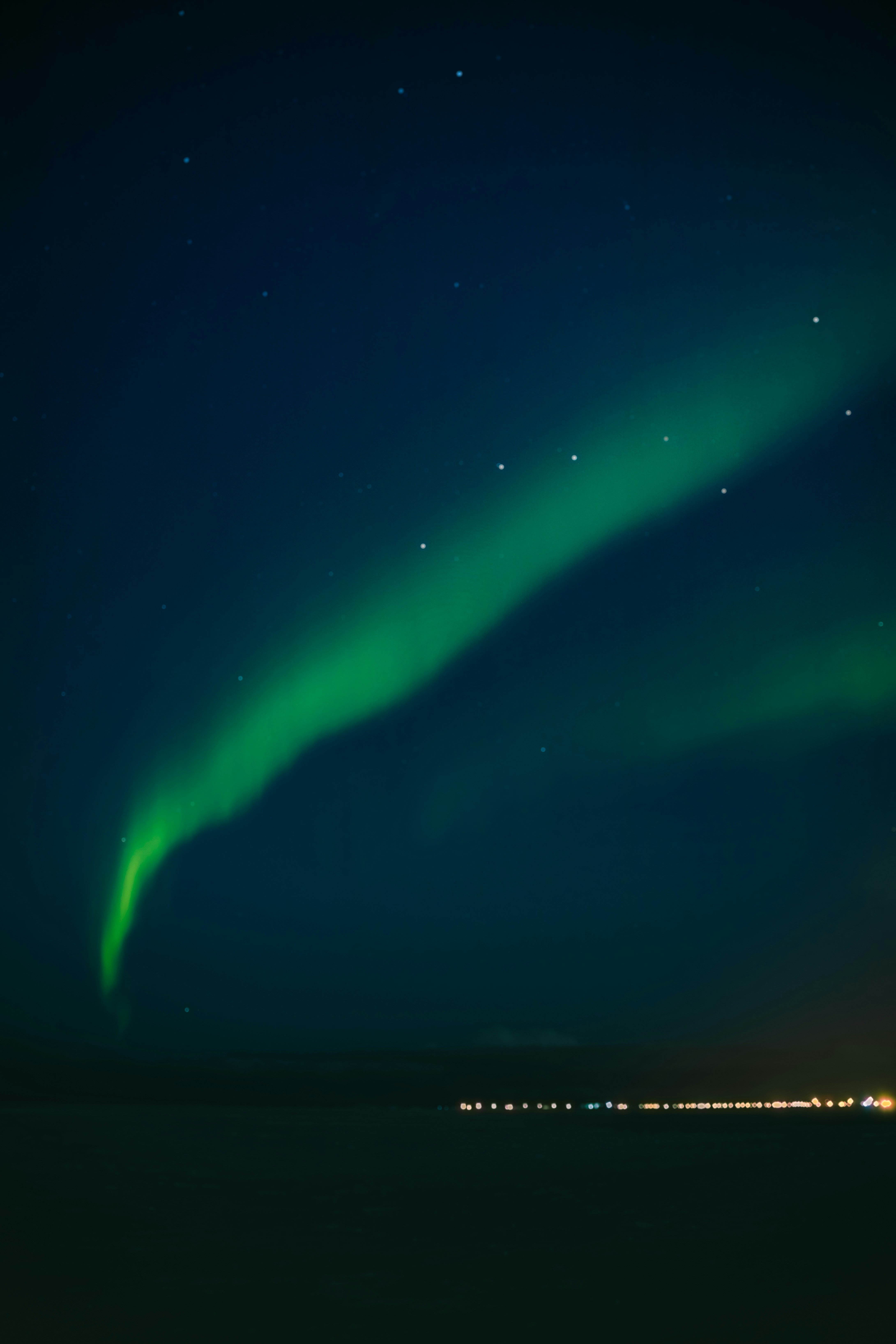 green and black sky with stars