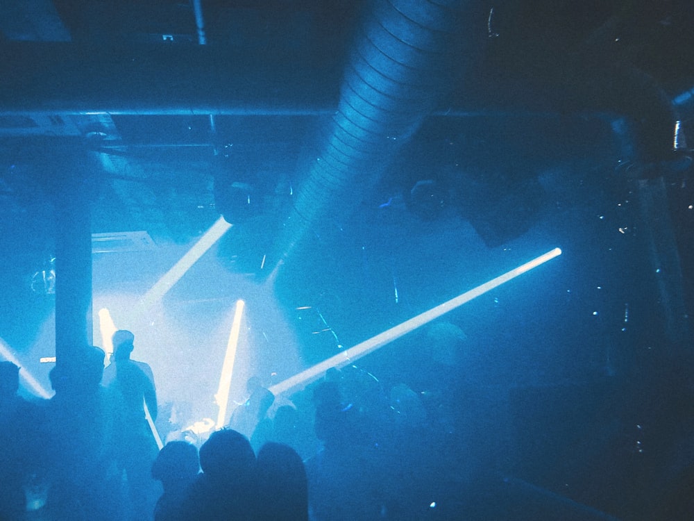 people standing on stage during nighttime