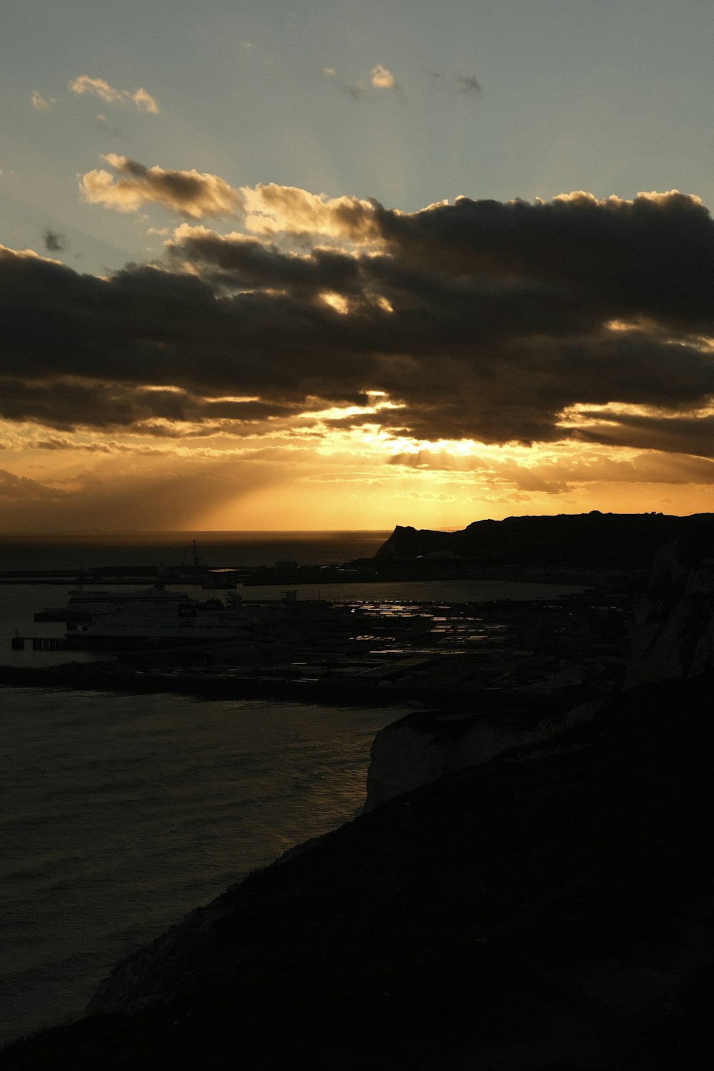 silhouette of people on beach during sunset