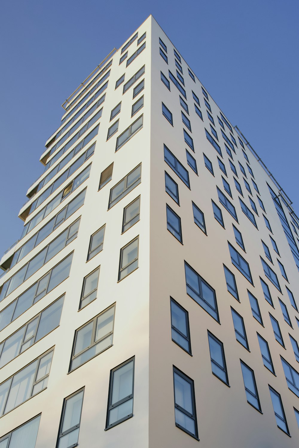 a tall white building with lots of windows