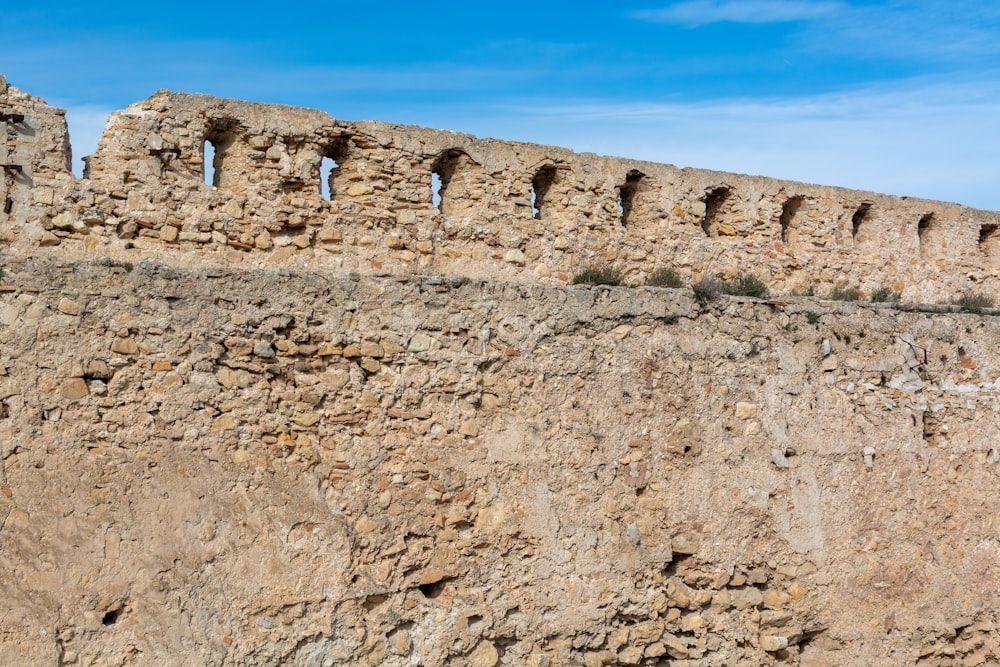 brown rock formation under blue sky during daytime