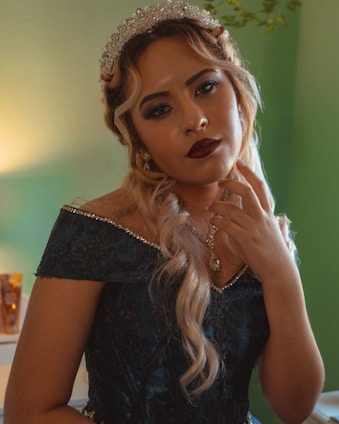 A glowing prom queen in a blush pink gown, surrounded by soft golden fairy lights.
