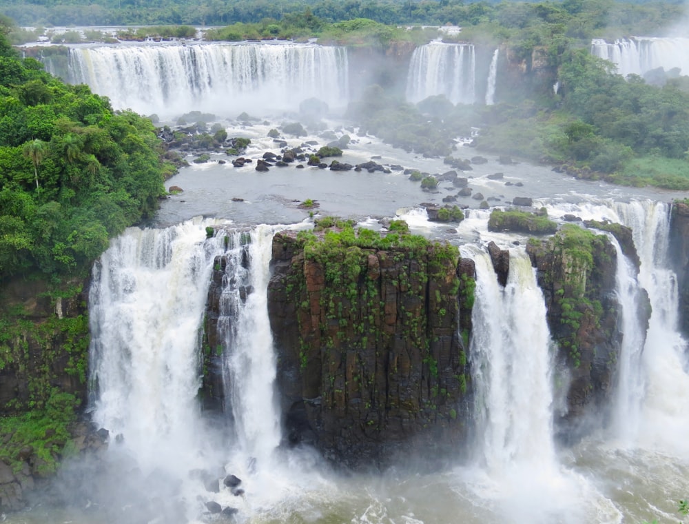 water falls in the middle of the forest