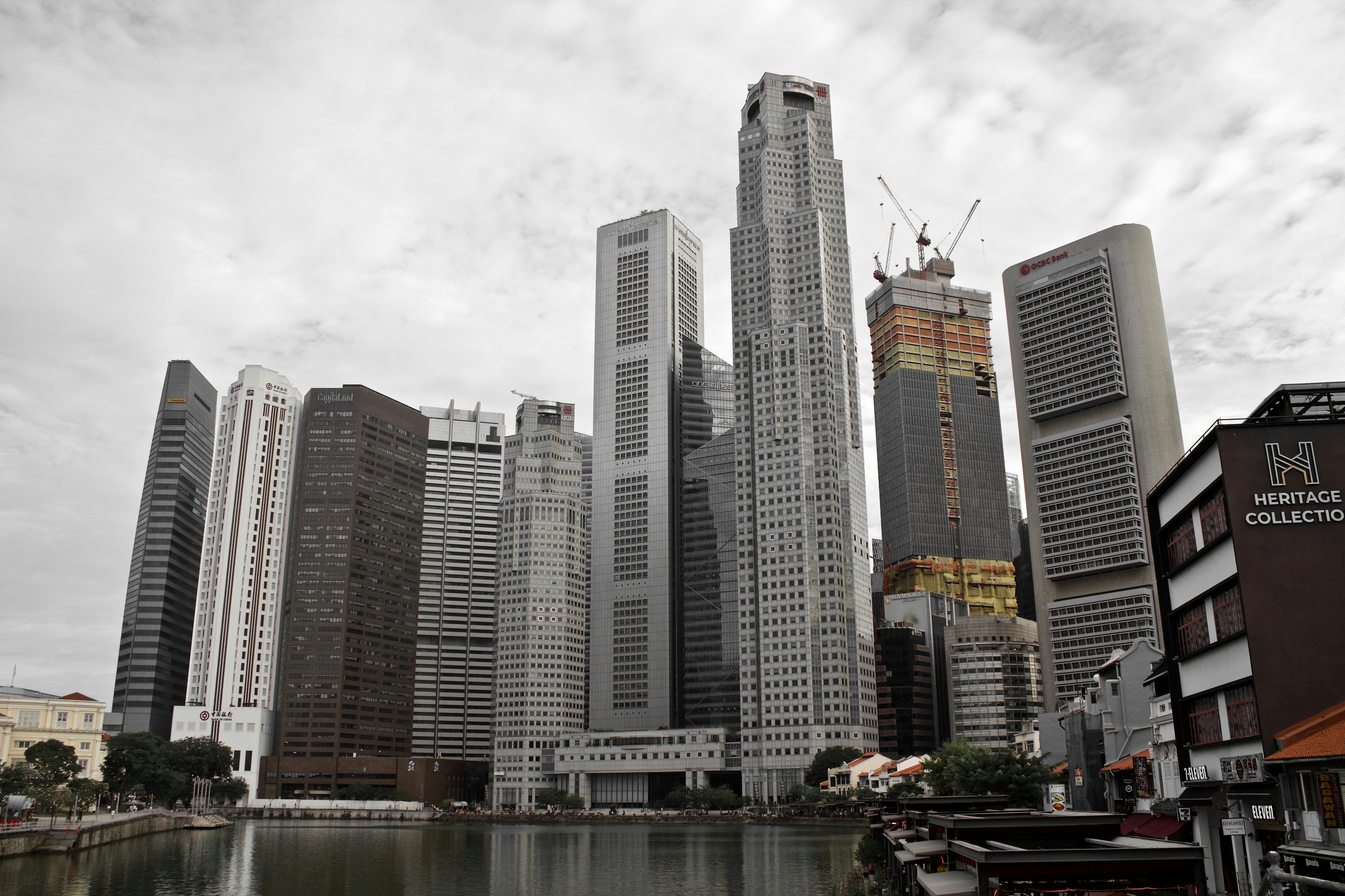 high rise buildings near body of water during daytime