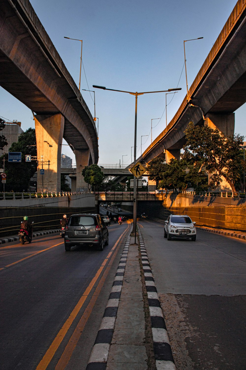 black suv on gray concrete bridge during daytime