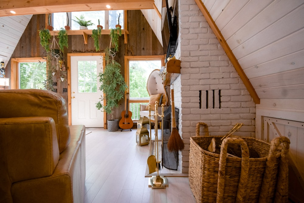 brown wooden acoustic guitar near brown wicker armchair