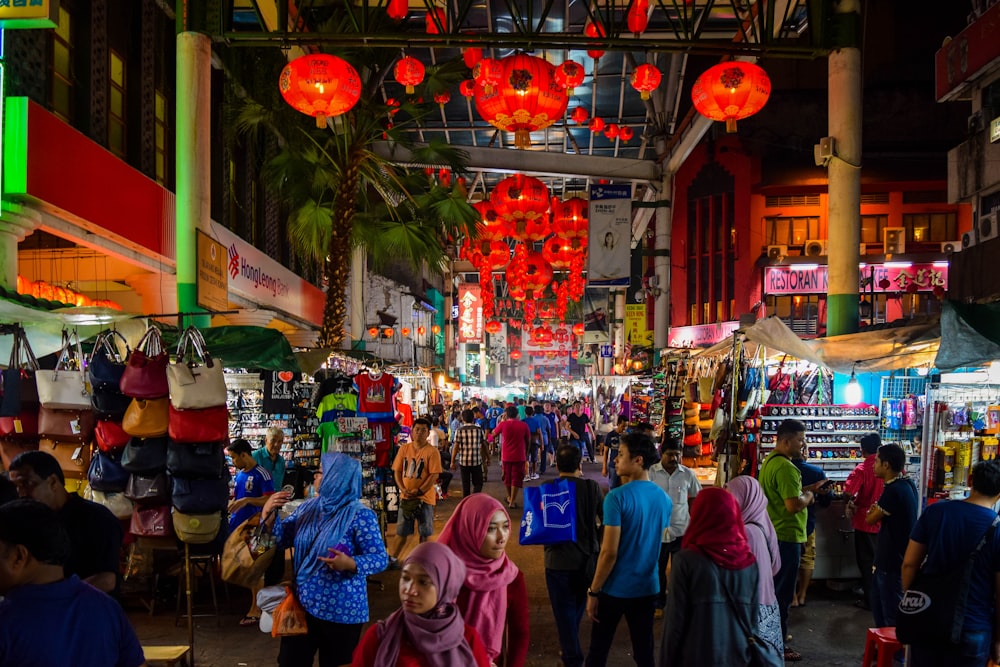 people walking on street during nighttime