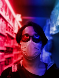 woman in red and black collared shirt wearing black sunglasses