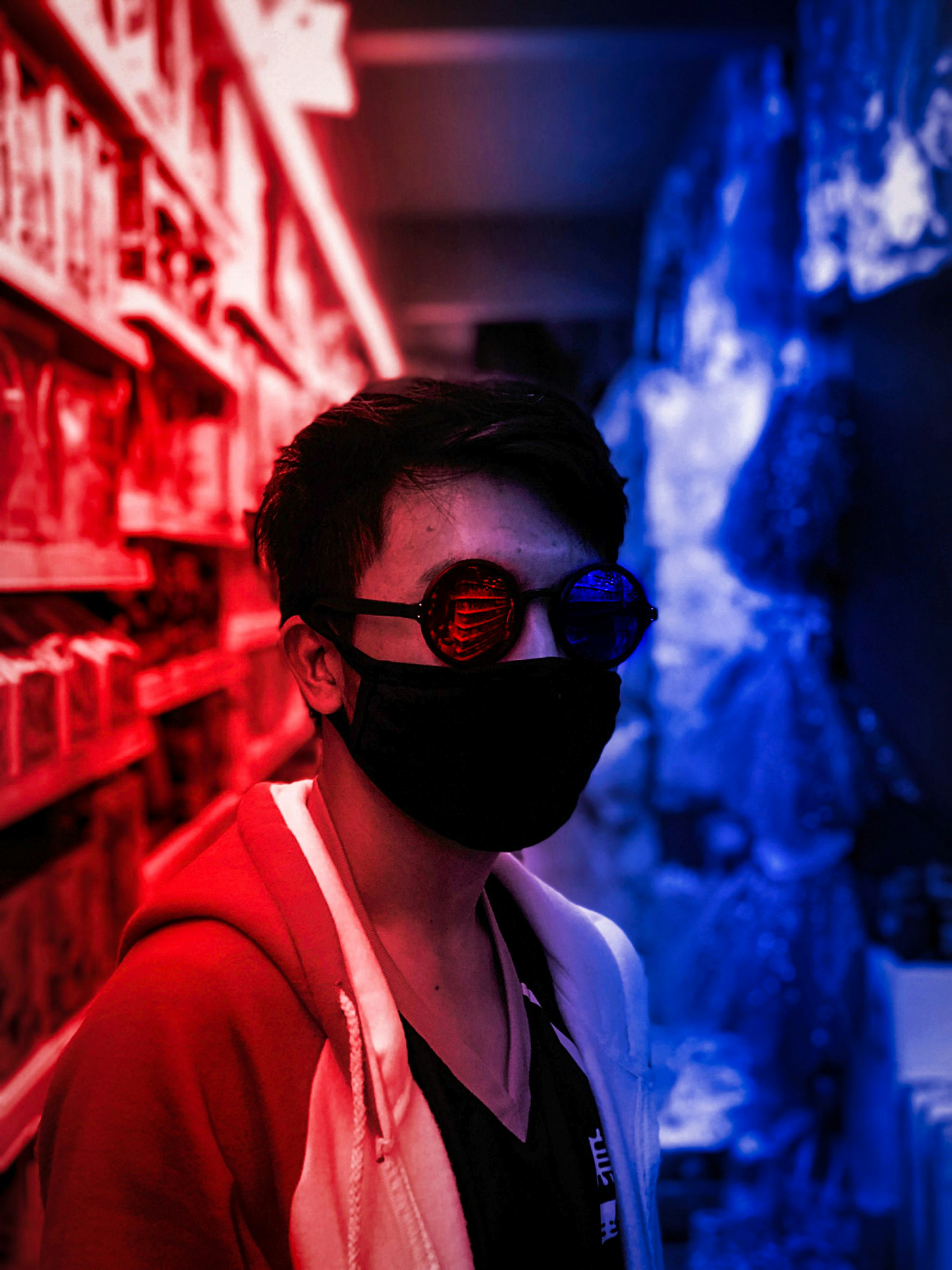 woman in red jacket wearing black sunglasses