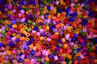 A close-up view of colorful nanoparticles on a lab table.