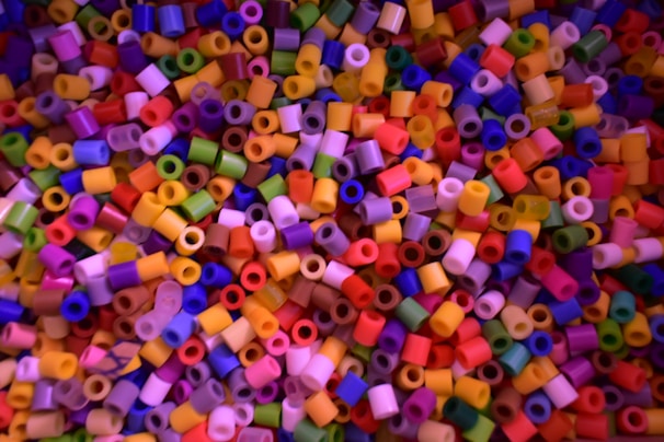 A close-up view of colorful nanoparticles on a lab table.