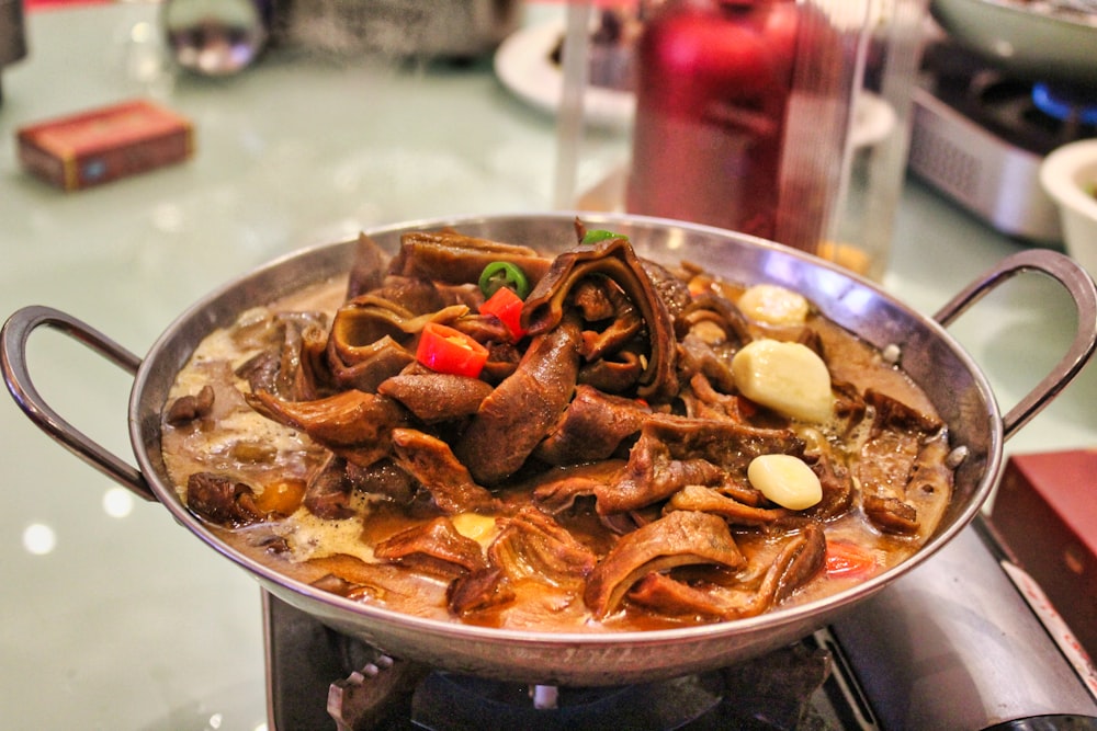 cooked food on stainless steel bowl