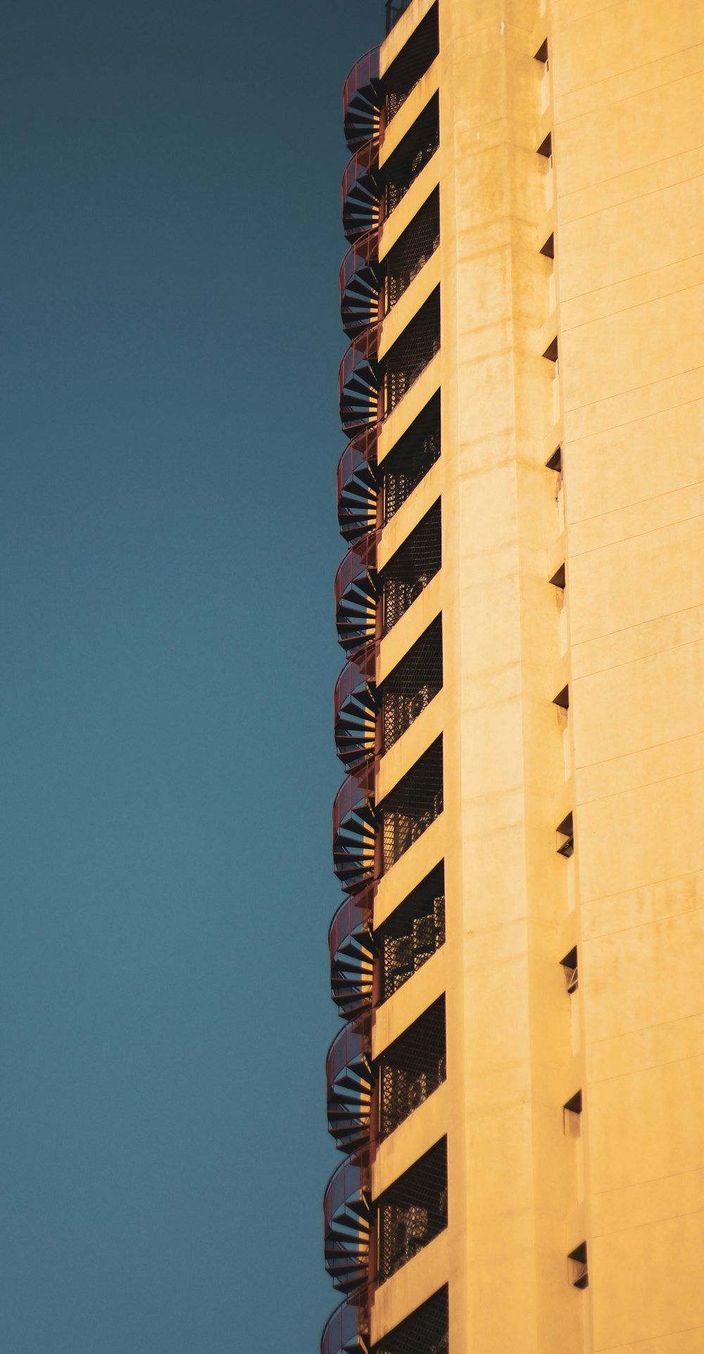 brown concrete building under blue sky during daytime