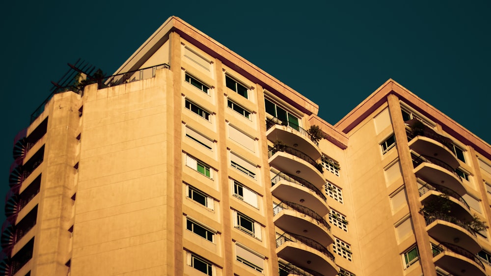 beige concrete building under blue sky during daytime