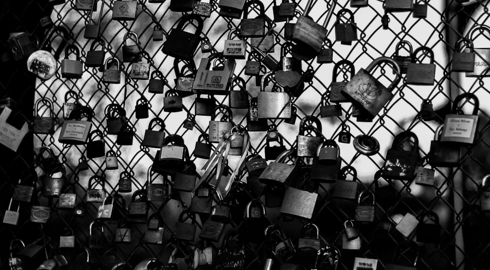 padlock on fence during daytime