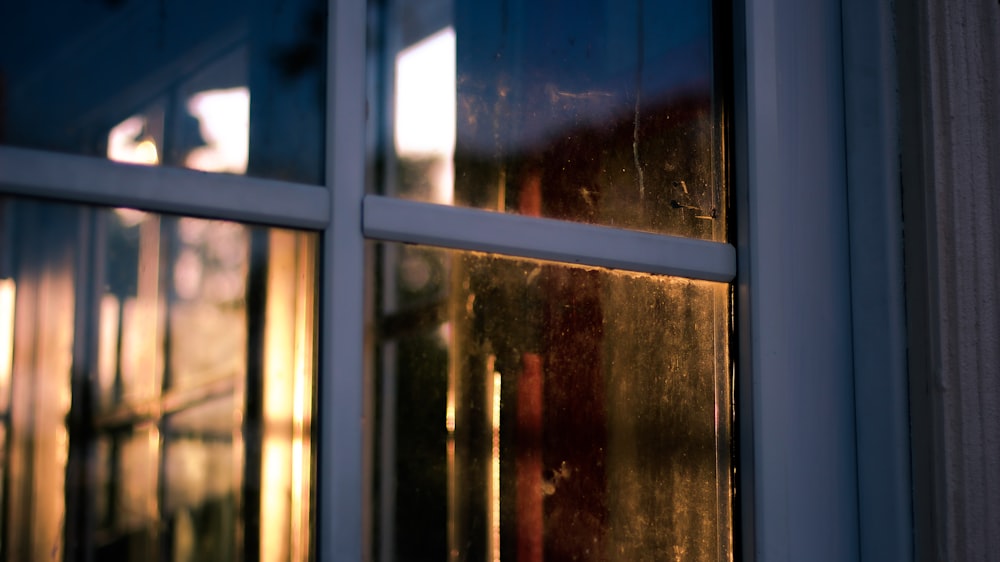 white wooden framed glass window