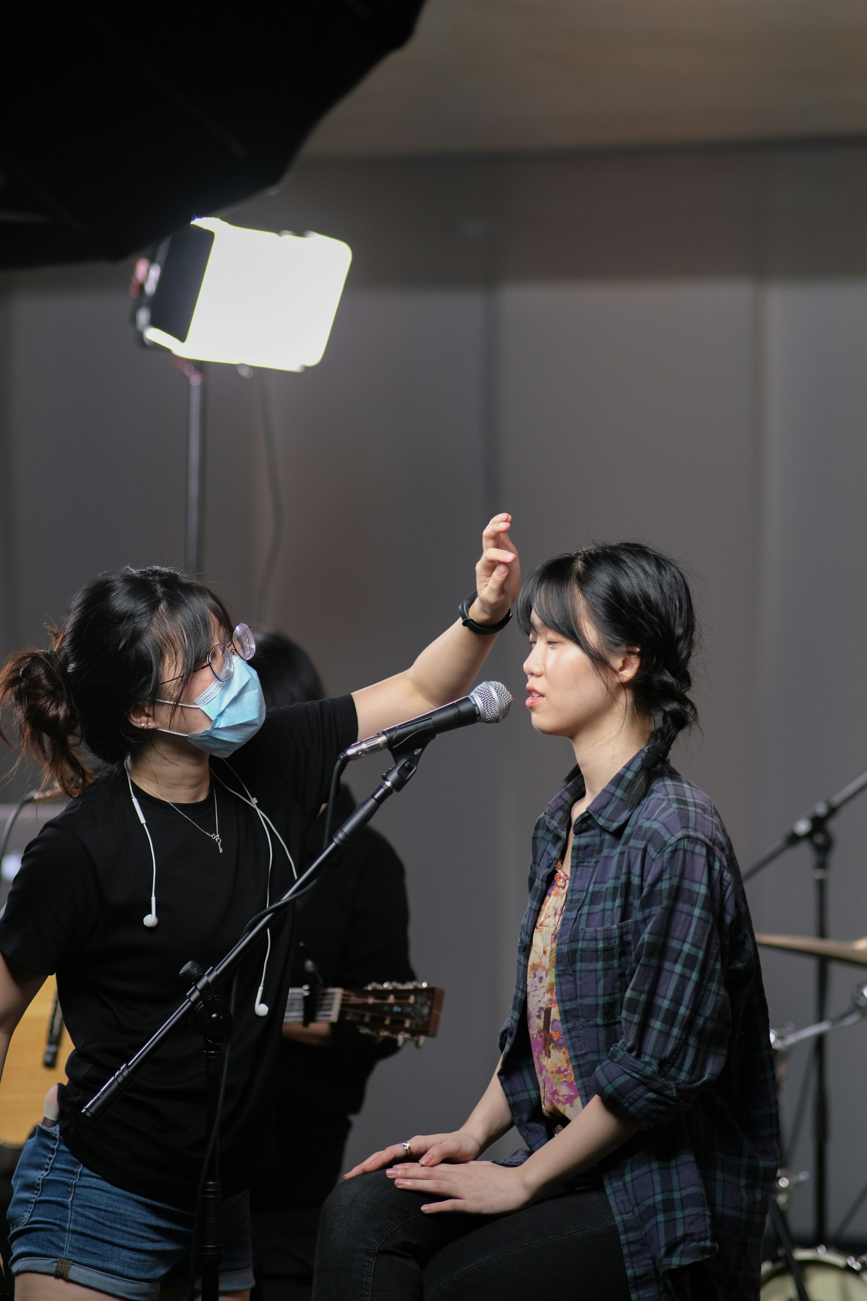 woman-in-black-crew-neck-t-shirt-holding-microphone