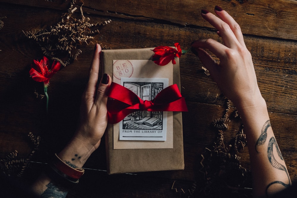 red ribbon on white greeting card