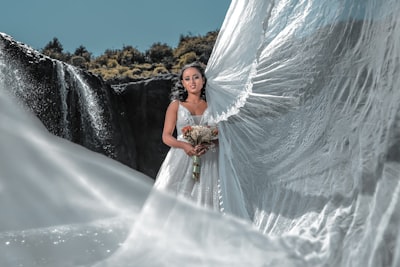 woman in white wedding gown standing on snow covered ground during daytime ethiopia teams background