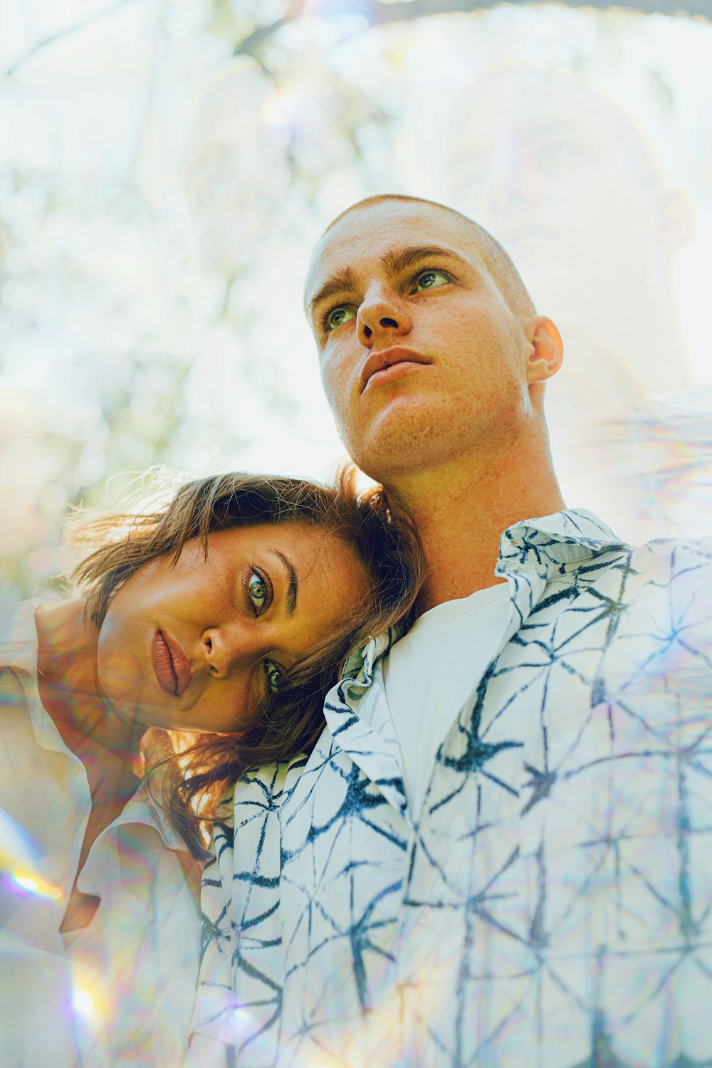 man in white and blue floral button up shirt beside woman in white shirt