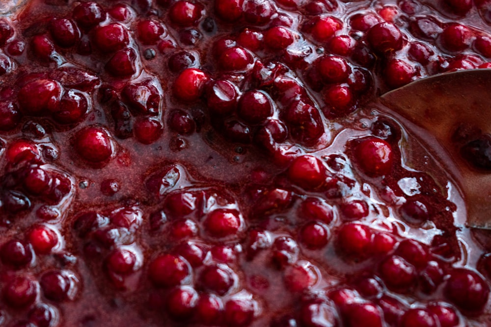 red liquid in clear glass