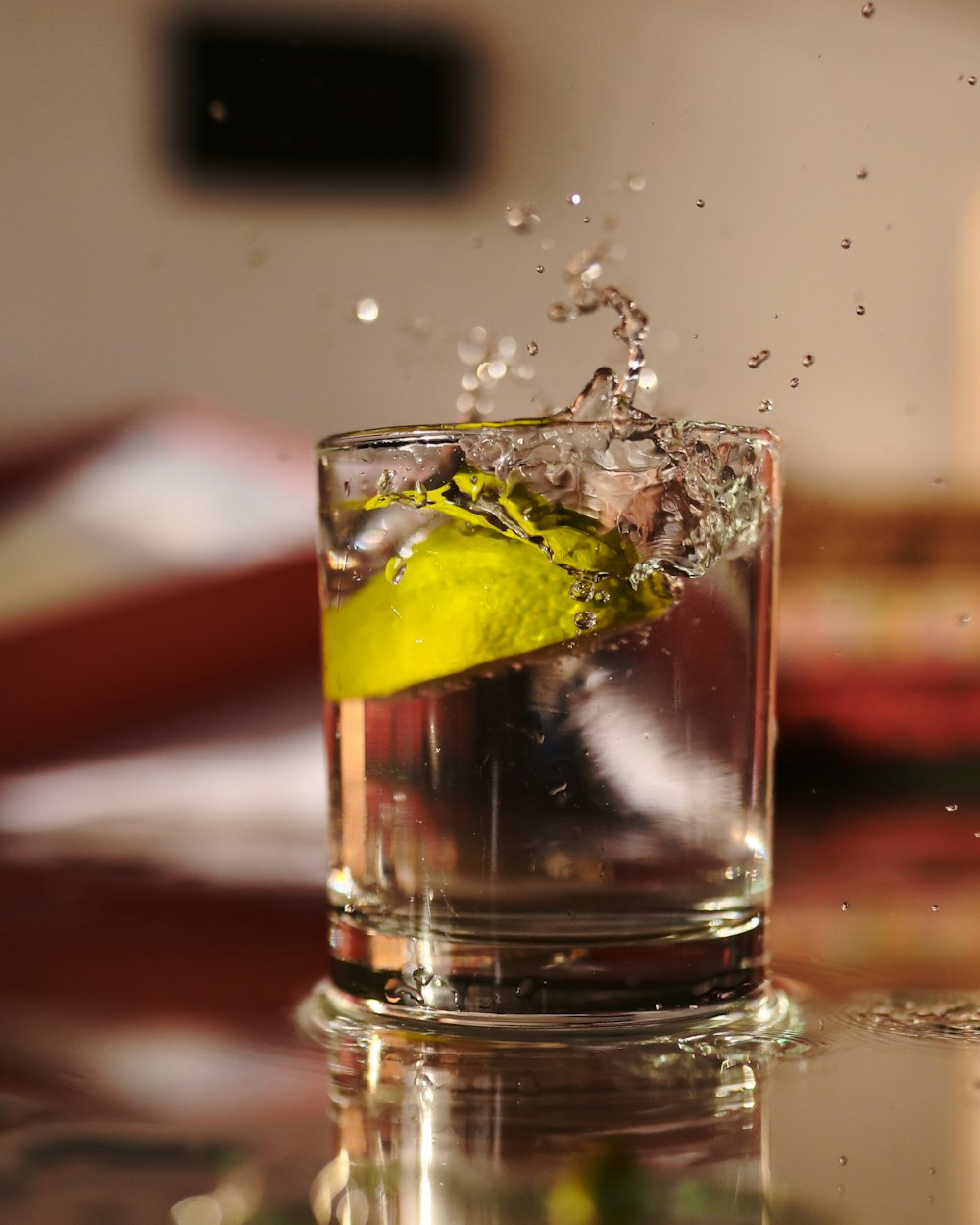 clear drinking glass with ice and lemon