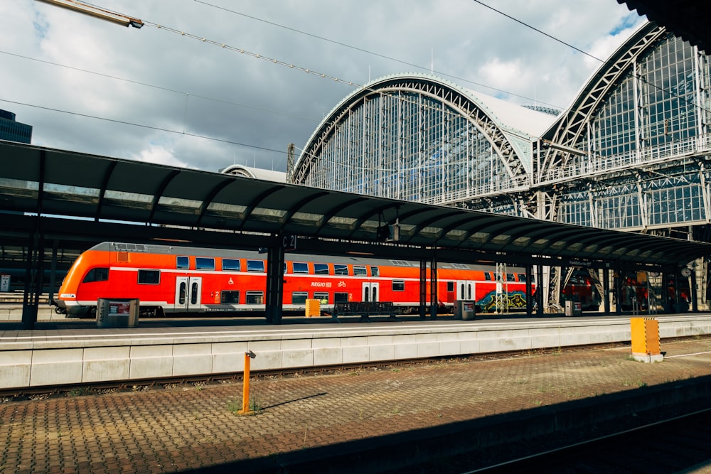 red and white train on rail tracks