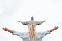 woman in white long sleeve shirt and blue denim jeans