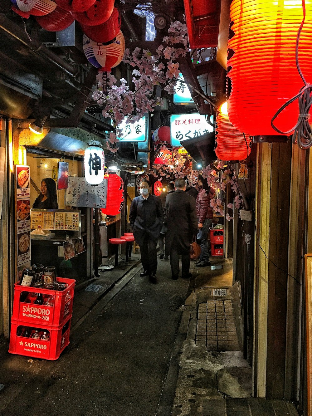 people walking on street during nighttime