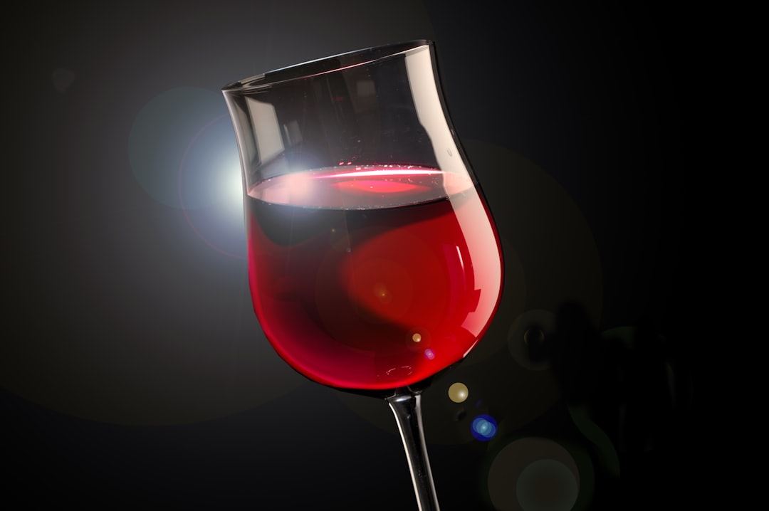 clear wine glass with red wine