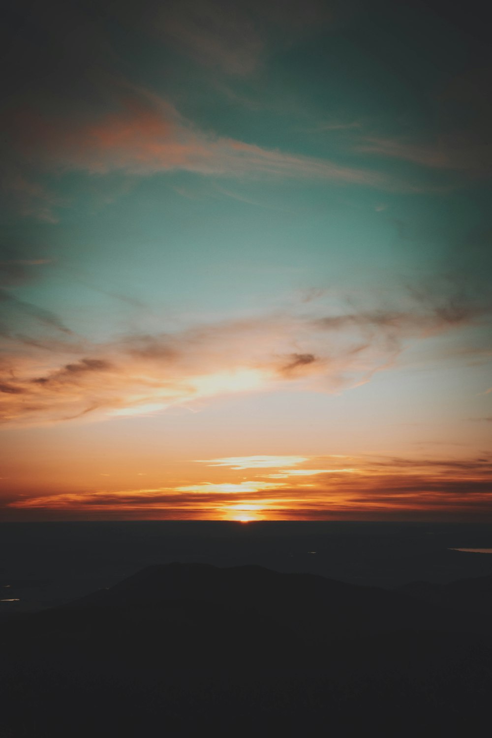 silhouette of mountain during sunset