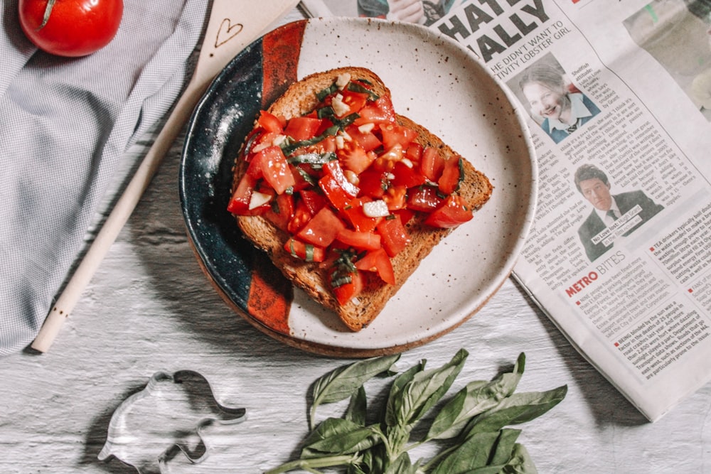 sliced tomato on white ceramic plate