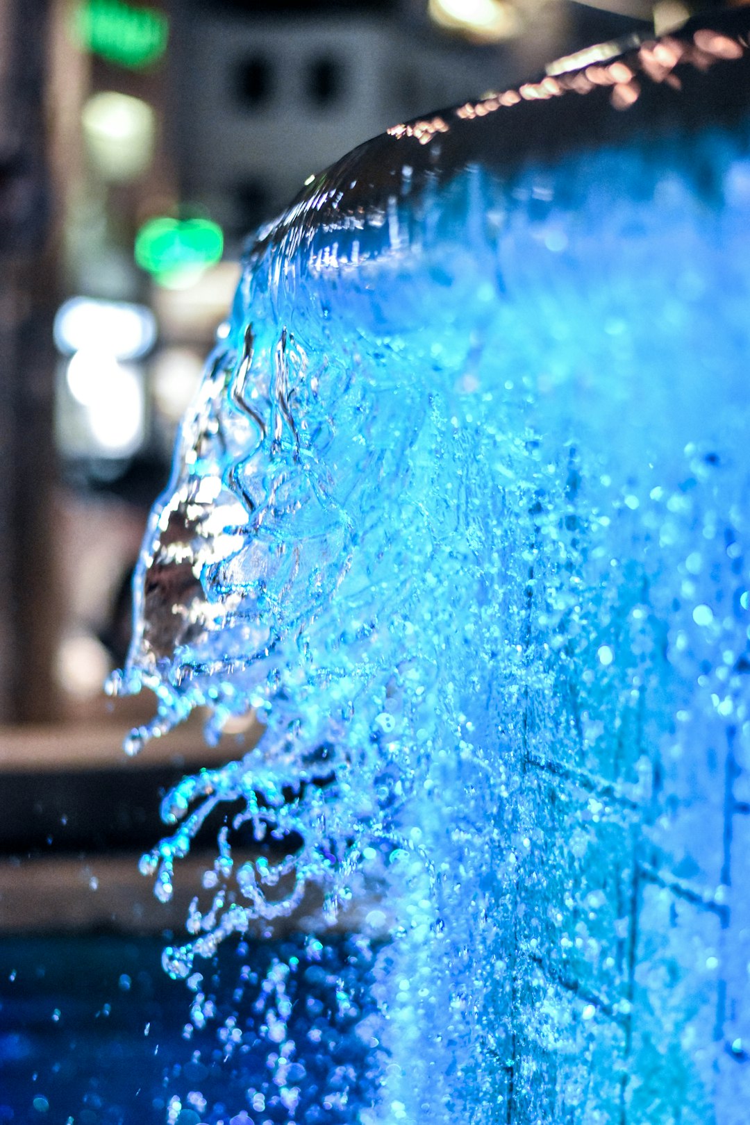 blue water splash in close up photography