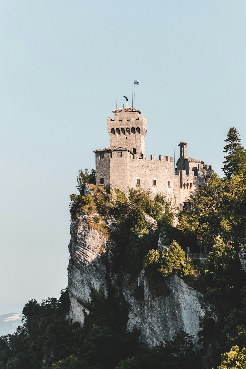 brown concrete castle on top of mountain