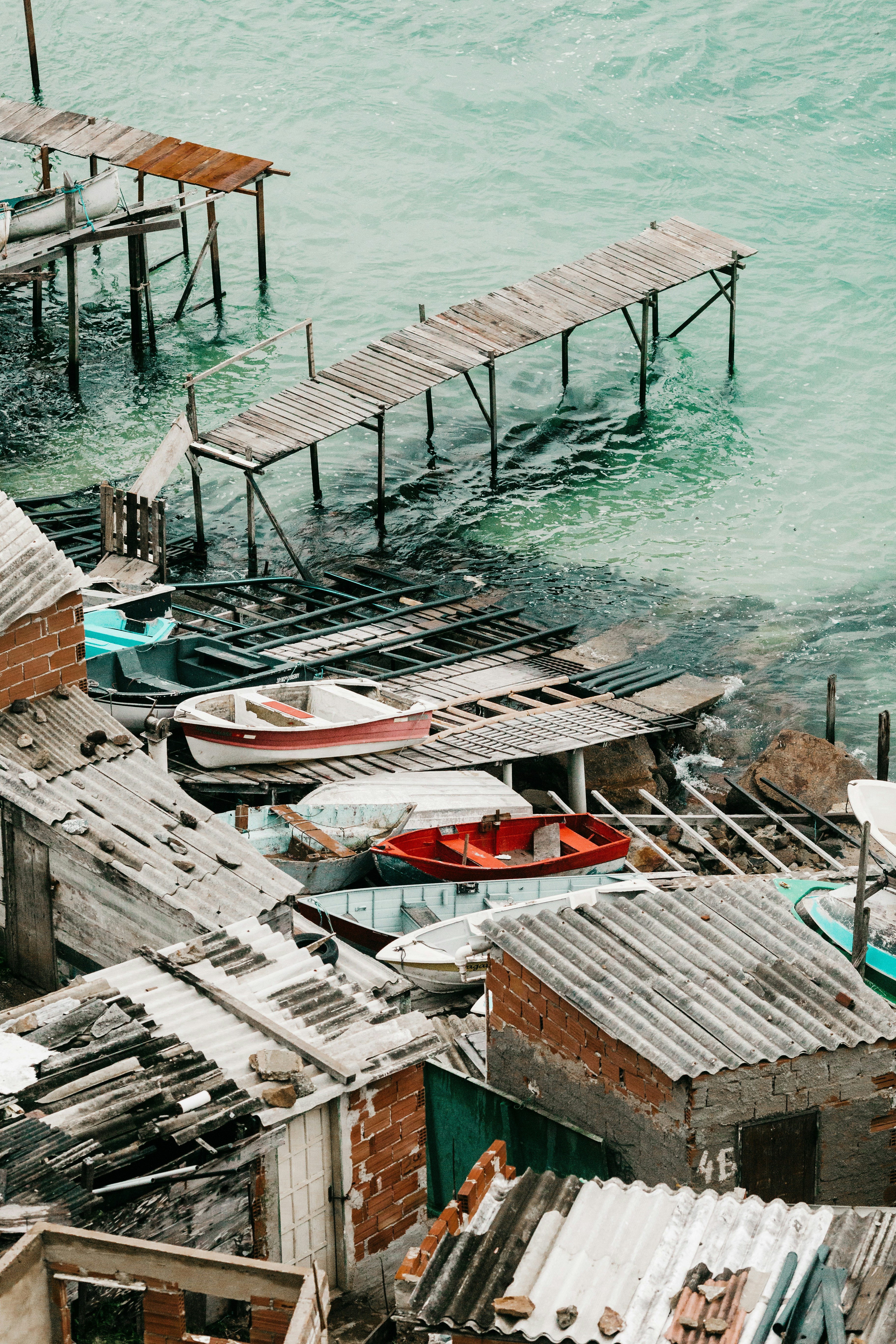 brown wooden dock on body of water during daytime