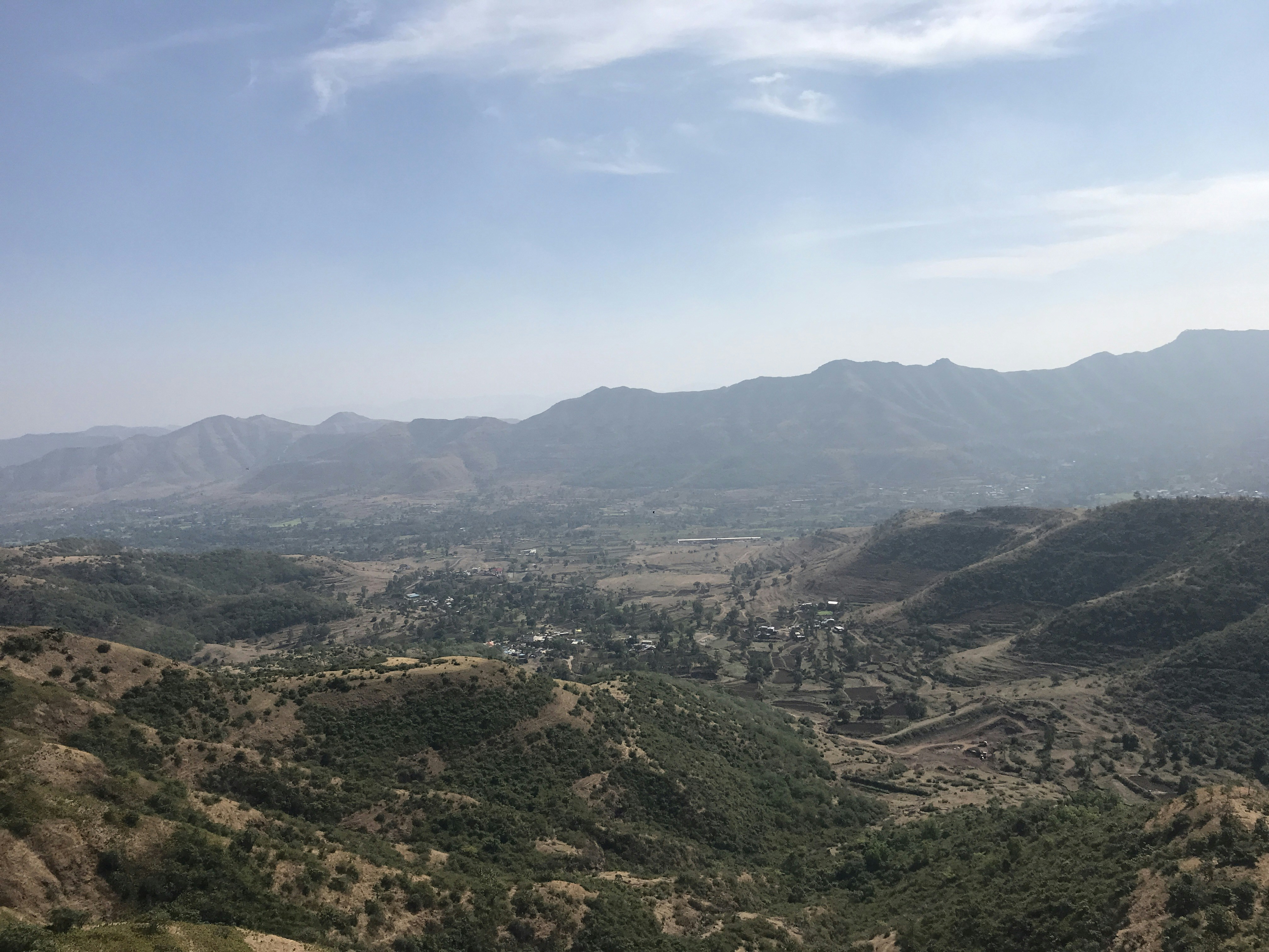 green and brown mountains under blue sky during daytime