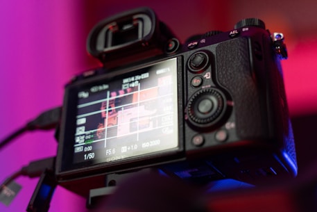 black dslr camera on black table