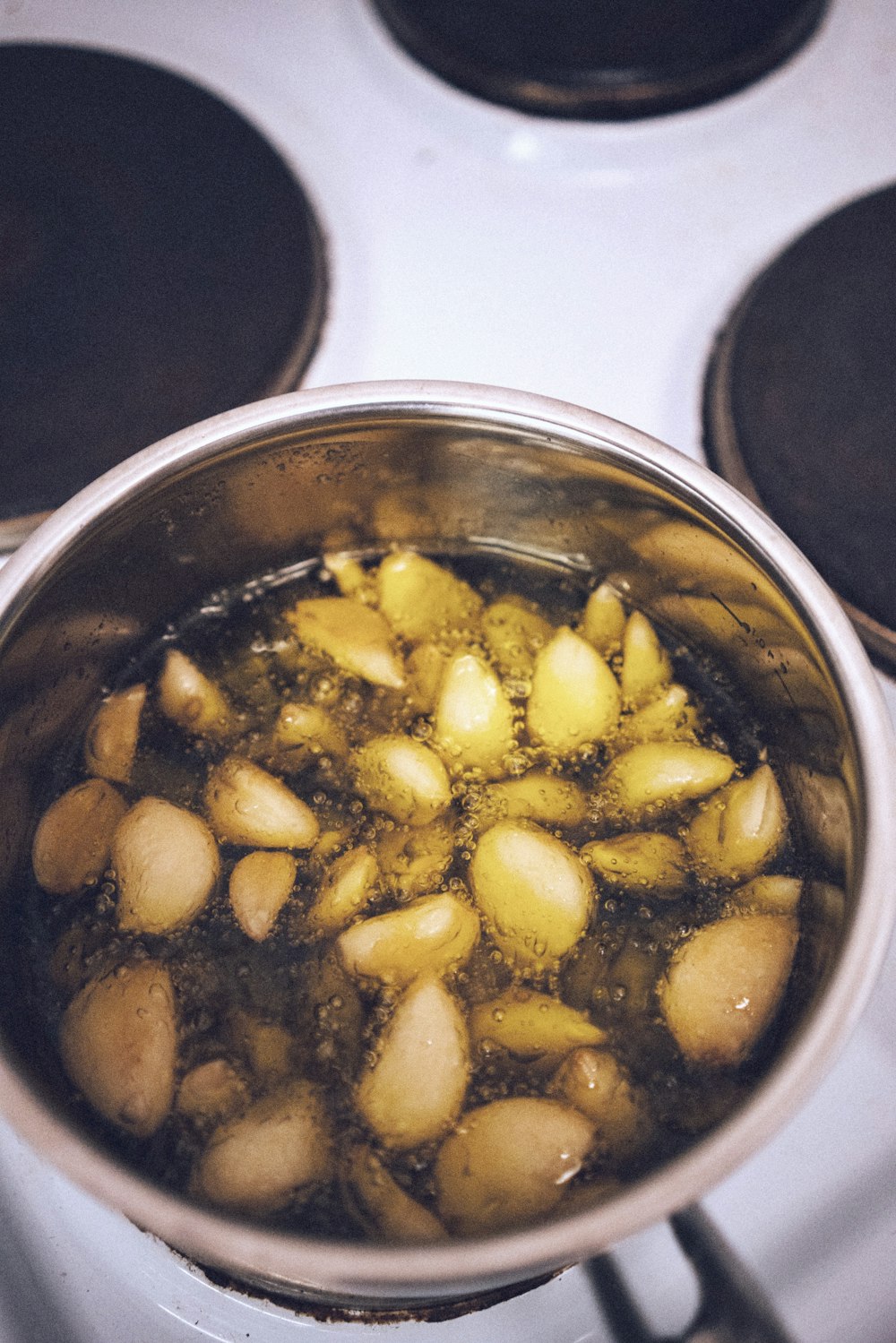 brown and yellow food in stainless steel cooking pot