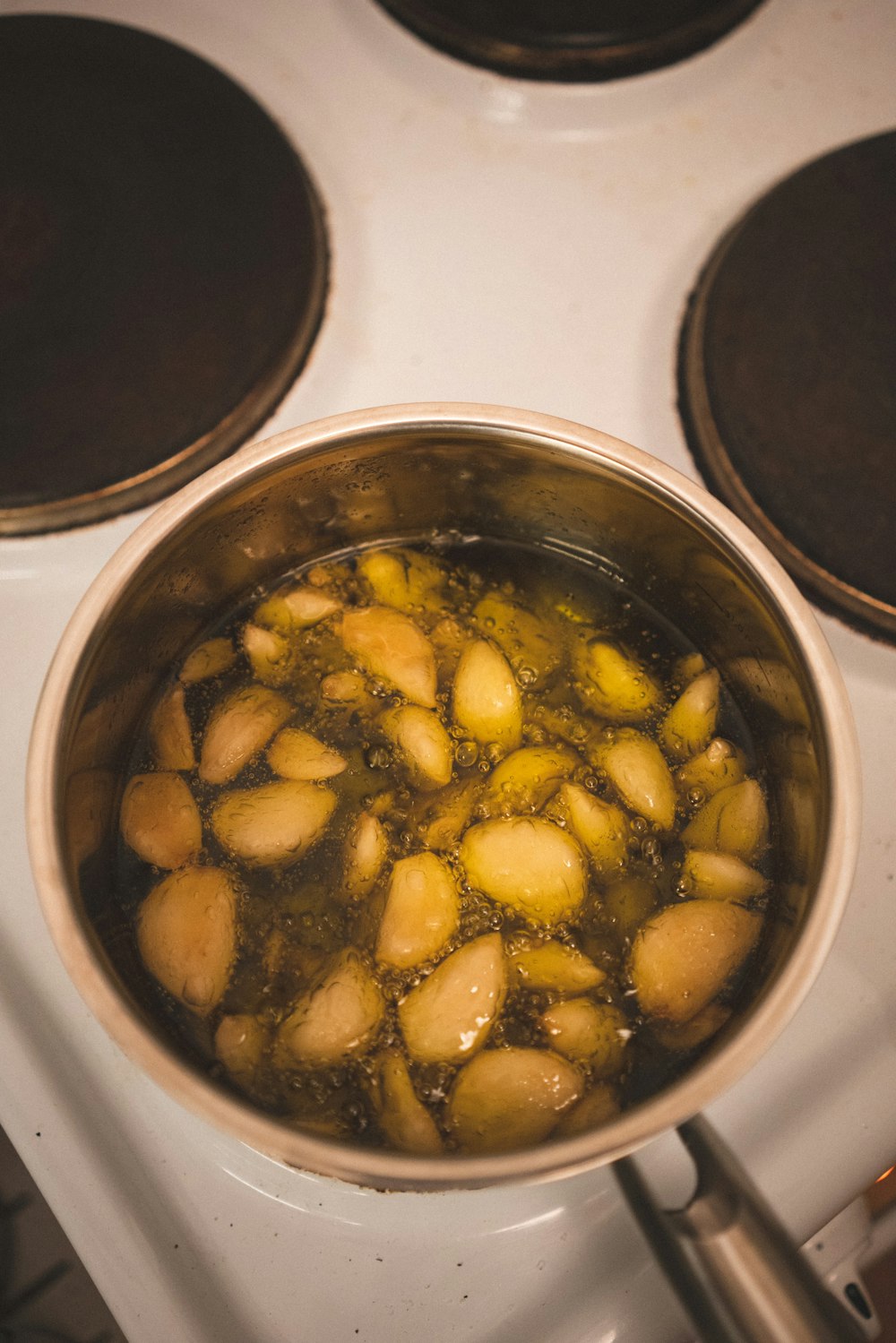 stainless steel bowl with yellow and green food