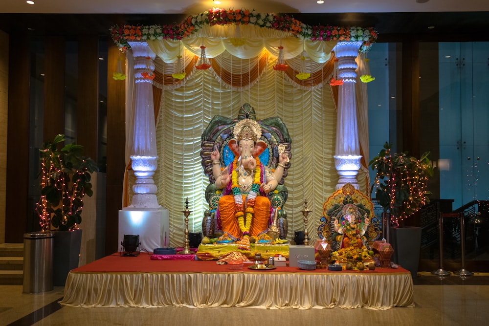 hindu deity figurine on red table