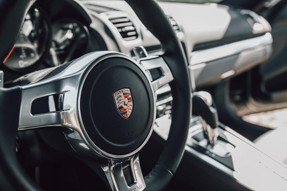 black and silver nissan steering wheel