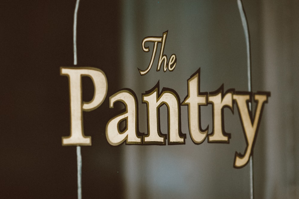 a close up of a sign that says the pantry
