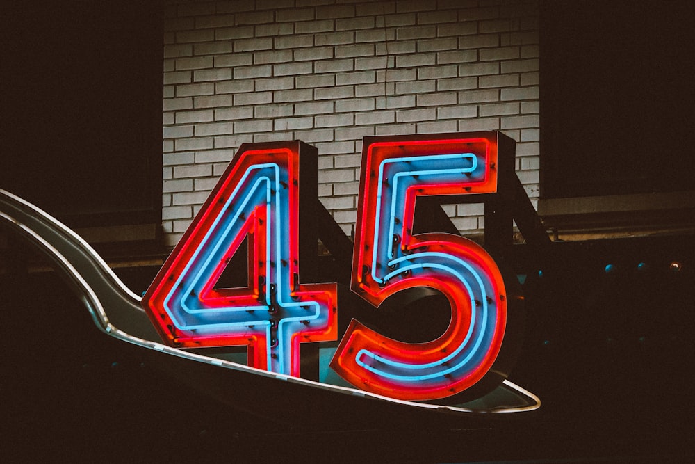 a neon sign with the number forty five