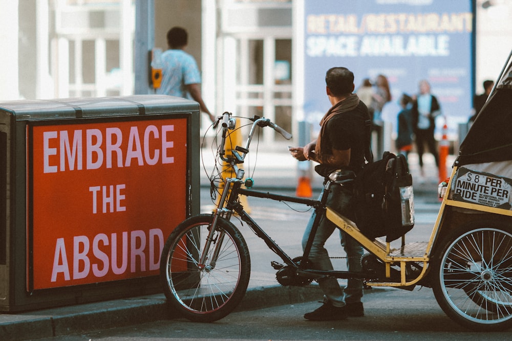 man in black jacket riding bicycle