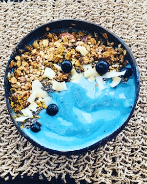 A vibrant blue-themed wellness coach guiding a happy client through healthy lifestyle choices.
