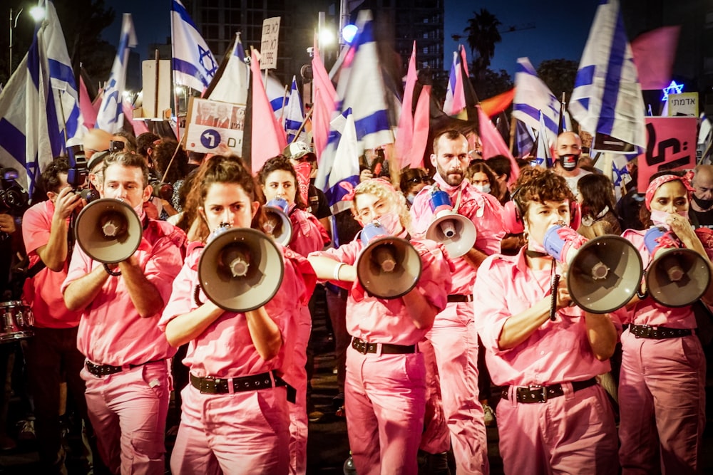 group of people wearing pink and white shirts